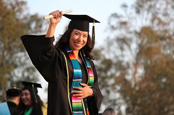 A student graduates with her degree in exercise physiology