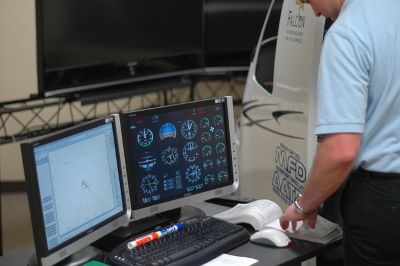 Test pilot study activities during test pilot school involve simulators like this one.