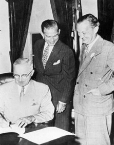 Harry S. Truman signs the Fulbright bill